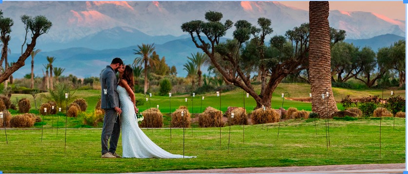 Romantic wedding moment in Marrakech, Morocco, with the stunning Atlas Mountains as a picturesque backdrop