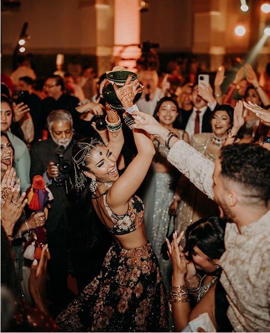 Traditional celebration during a vibrant wedding in Marrakech, Morocco, showcasing cultural dances and joyous moments.