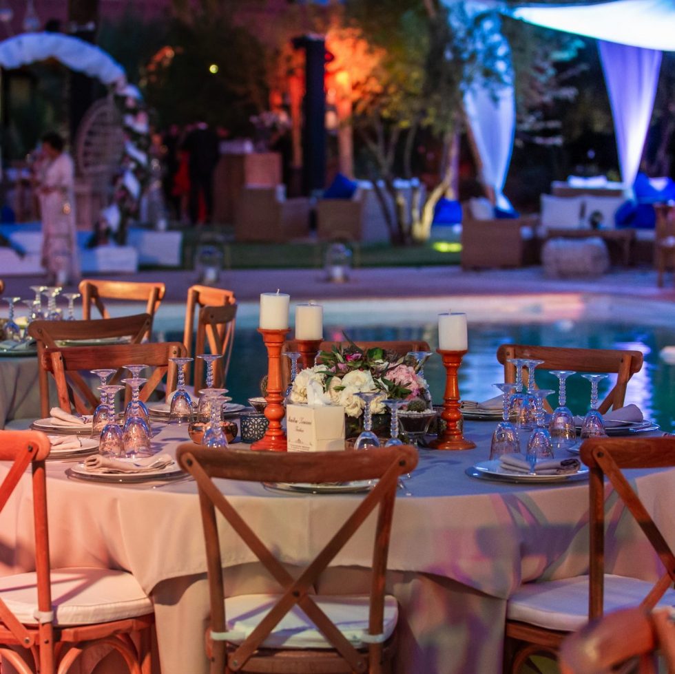 Elegant guest table setup at a hotel for a Moroccan wedding, designed by Moroccan wedding planners