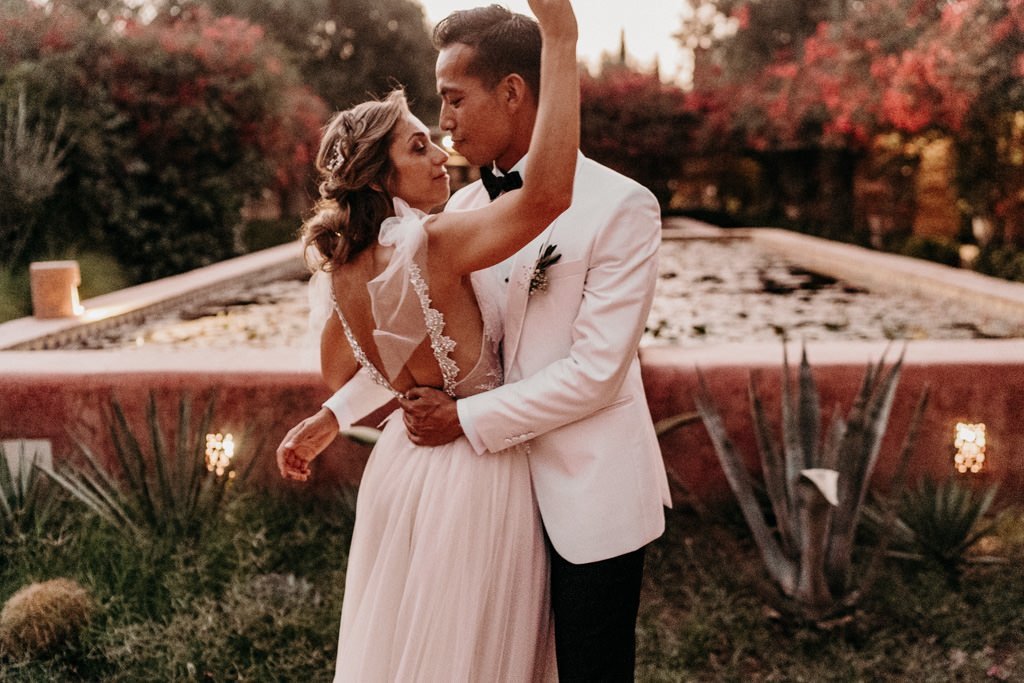 Bride and groom in the garden of a Marrakech riad